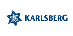 Karlsberg - Das Logo zeigt den Karlsberg Schriftzug in blauer Schrift auf weißem Hintergrund - Links daneben ist ein blauer Stern mit der Jahreszahl 1887 und einem Mann auf einem Sprungball